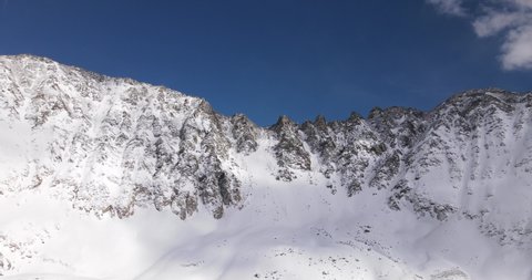 Aerial shot of the mountains of Mayflower Gulch, CO in the winter