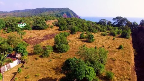 A drone flying over the cabo de rama fort during the day in south Goa, India.