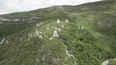 Curious watchtowers in Arrabida Natural Park, Setubal, Portugal; drone pan