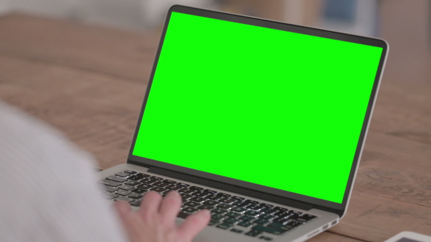 Young Man using Laptop with Green Screen | Shutterstock HD Video #1088364203