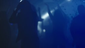 Cheerful woman dancing at party, people enjoying evening in club. Nightlife, modern music and entertainment concept. - Powered by Shutterstock - Get 15% off with code: PIKWIZARD15