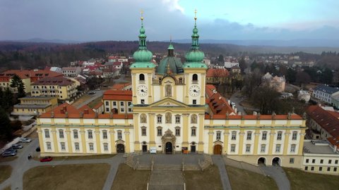 Basilica of Minore Visitation of the Virgin Mary on Svatý Kopeček in Olomouc on a hilly staircase along which the visitor is walking - static shot