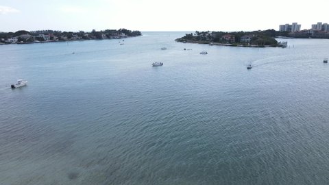 aerial of boating in New Pass, Sarasota, Florida on any given weekend