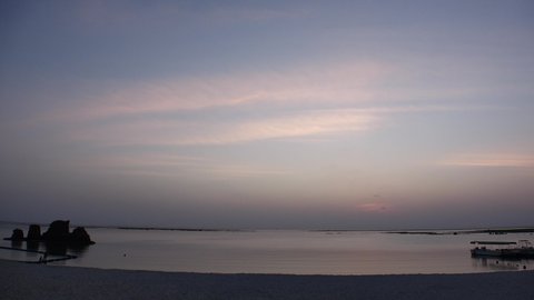 CHTAN-CHO, OKINAWA, JAPAN - AUGUST 2021 : View of Araha beach (Ocean or sea) in dusk. Sunset sky and sea. Romantic summer holiday, vacation and resort concept video.