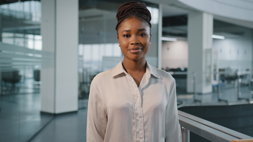 African millennial 30s successful confident strong businesswoman feminism worker lady boss female leader multiracial woman in formal shirt posing crossing arms looking at camera in office corporate Royalty-Free Stock Footage #1088367575