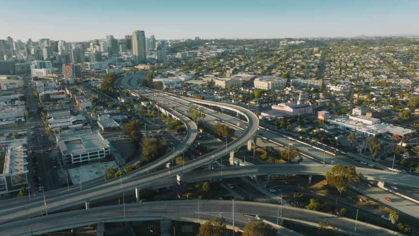 Scenic aerial of cars driving at cross roads. Modern cityscape at summer. Traffic highway transportation. Skyscrapers buildings at downtown streets. Business center of San Diego, California USA 4K Royalty-Free Stock Footage #1088368207