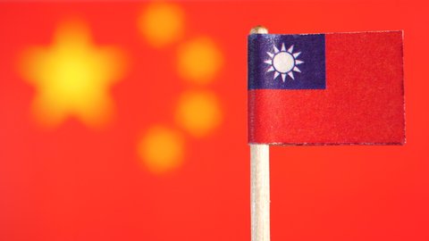 Taiwan and Chinese Flag in Rack Focus