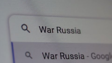 New York, United States - March 2022: Searching for "War Russia" on the Internet. Close Up. 