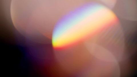 Multicolored light leaks 4k footage on black background. Lens studio flare leak burst overlays. Natural lighting lamp rays bokeh effect. For compositing over your project, stylizing video, transitions