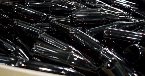 Clean beer and wine bottles. Beer bottles in production and bottling. Technological line. factory concept. Glass recycling process, Recycled beer bottles in factory. conveyor belt at bottle factory