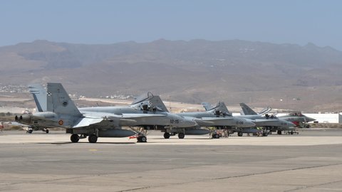 Gando Airport Gran Canaria Spain OCTOBER, 21, 2021 Combat fighter jets parked at NATO military airport ready for war training exercise. McDonnell Douglas F-18 Hornet of Spanish Air Force