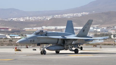 Gando Airport Gran Canaria Spain OCTOBER, 21, 2021 Military plane taxiing to the parking lot during a NATO war exercise. McDonnell Douglas F-18 Hornet of Spanish Air Force