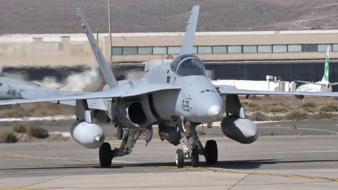 Gando Airport Gran Canaria Spain OCTOBER, 21, 2021 Supersonic multirole combat jet aircraft taxiing to the park lot in a military airport. McDonnell Douglas F-18 Hornet of Spanish Air Force