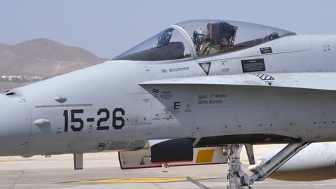 Gran Canaria Spain OCTOBER, 21, 2021 Military pilot in the cockpit of a fighter jet with helmet, lowered visor and oxygen mask. Boeing F-18 Hornet of Spanish Air Force. Close-up 4k high quality video
