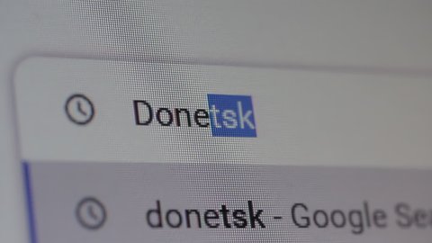 New York, United States - March 2022: Searching for "Donetsk, Ukraine" on the Internet. Close Up. 