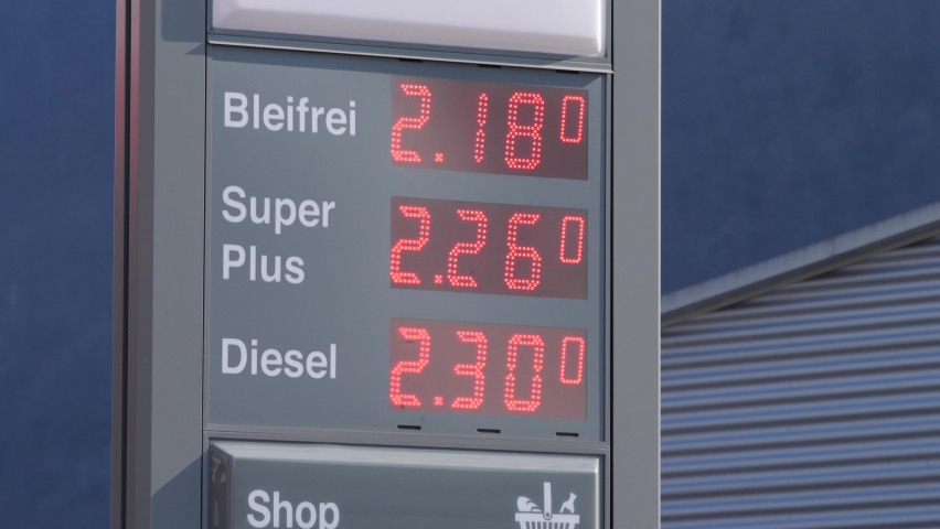Handheld digital sign on a petrol station, shows high price due to economic crisis Royalty-Free Stock Footage #1088389295