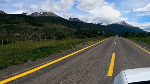 Car driving through Torres del Paine National Park in Patagonia, Chile