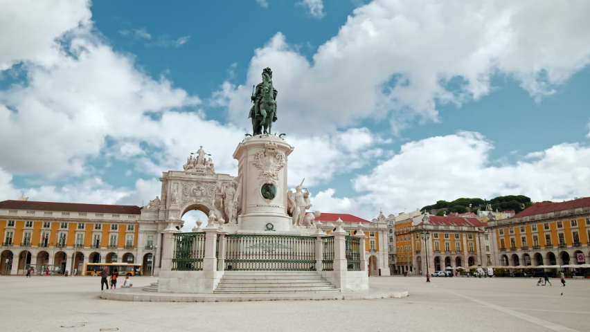 Arco da Rua Augusta - Historical Place in the City center of Lisbon, Portugal. The main most famous square in Lisbon on a sunny day, enjoying colored buildings and traditional Portuguese Architecture Royalty-Free Stock Footage #1088394589