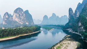 Aerial footage of beautiful mountain and river natural scenery in Guilin, China. Beautiful mountains in the morning fog.