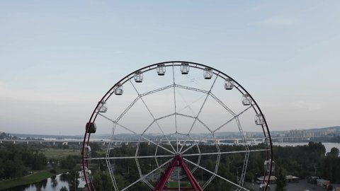 ferris wheel. flying in the air, an island in the center of Irkutsk. summer, bridge on the background