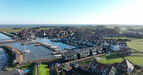 Harbour of Marken old historic characteristic picturesque fishing village touristic sight seeing town on a small peninsula in Noord Holland near Amsterdam and Volendam in The Netherlands.