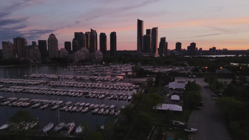Aerial view of a beautiful spring sunrise in the Humber Bay in Toronto, overlooking modern buildings.