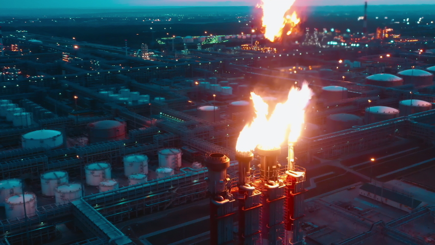 Gas-flaring pipes of the oil refinery filmed at night Royalty-Free Stock Footage #1088402197