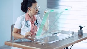 Medical female doctor scientist working at  digital futuristic computer. Transparent display with 3D Hologram DNA data. - Powered by Shutterstock - Get 15% off with code: PIKWIZARD15