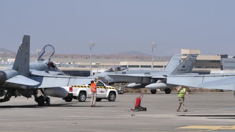 Gran Canaria Gando Military Air Base Spain OCTOBER, 21, 2021 Fighter jet aircrafts parked on a military airbase and other taxiing. Boeing F-18 Hornet of Spanish Air Force