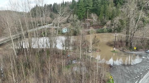 Cinematic 4K aerial drone orbit shot of flooding on the Green River Duwamish near Auburn in King County Washington