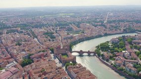 Inscription on video. Verona, Italy. Flying over the historic city center. Castelvecchio Castello Scaligero, summer. Text furry, Aerial View, Point of interest