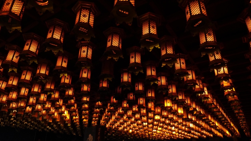 Interior of a praying hall in a japanese shrine. Japanese lantern on the roof, Japan. High quality 4k footage Royalty-Free Stock Footage #1088411699