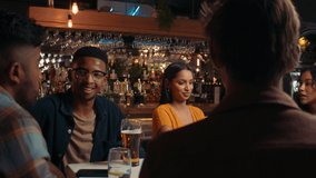 Diverse group of friends making a toast while out for drinks