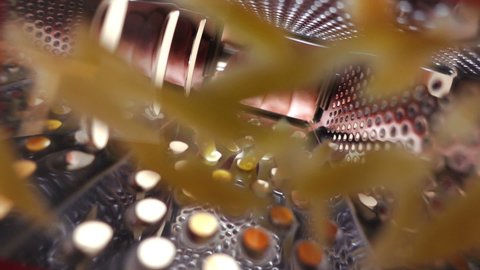 Cheese is grated into beautiful pieces, View underneath cheese grater, Extreme close up