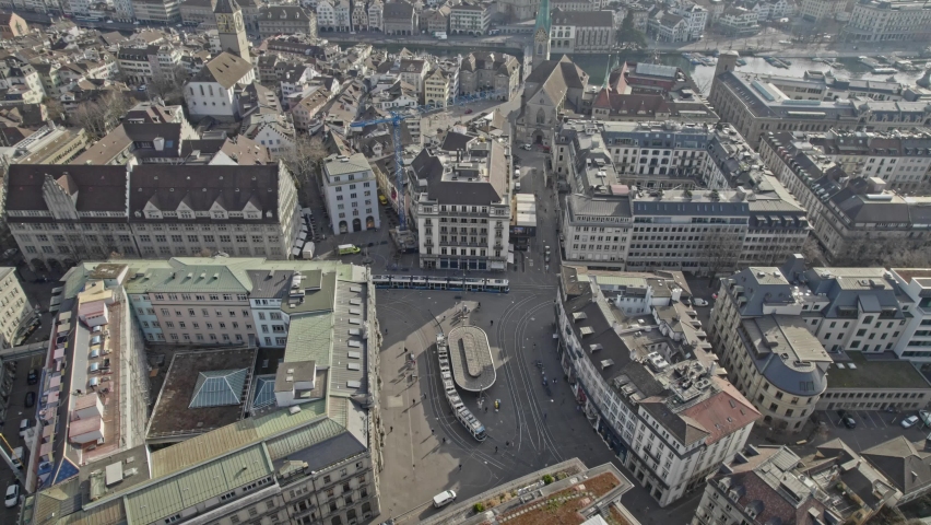 Aerial view of famous Parade Square with tram station and headquarters of famous Swiss Banks Credit Suisse and UBS on a spring day. Movie shot March 21st, 2022, Zurich, Switzerland. Royalty-Free Stock Footage #1088428389