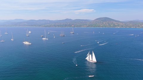 Saint-Tropez, France: Aerial view of lot of yachts and sailboats on Mediterranean Sea in city on French Riviera during famous regatta Les Voiles de Saint-Tropez - landscape panorama of Europe