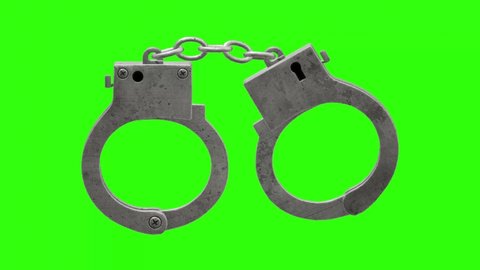 3D silver handcuffs rotation on green screen.animation video of police handcuffs.4K video.