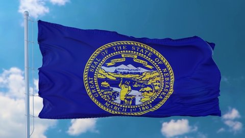 Flag of Nebraska state, region of the United States, waving at wind