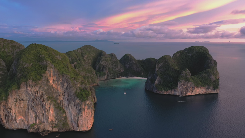 Aerial view of Phi Phi islands Travel Landmark of Krabi Phuket, Thailand. Amazing Drone shot over Maya beach with beautiful blue turquoise seawater in twilight. Tourist attraction in summer holidays. | Shutterstock HD Video #1088438241