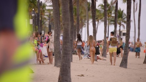 Fort Lauderdale, FL, USA - March 20, 2022: Spring Break tourists on Fort Lauderdale Beach FL 4k 60p