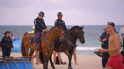 Fort Lauderdale, FL, USA - March 20, 2022: Horse police patrolling Fort Lauderdale Beach FL during 2022 Spring Break