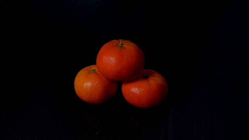 Tangerine pyramid zoom black background  - Powered by Shutterstock - Get 15% off with code: PIKWIZARD15