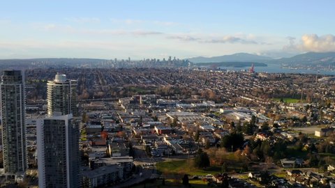 Panoramic View From Above Of Residential District In Burnaby, British Columbia, Canada. Vancouver Harbour In Distant Background. wide aerial