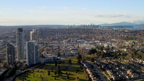 Big Grassy Park Between City Centre And Residential Town In Burnaby Canada - aerial shot
