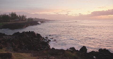 Scenic view of Hanga Roa bay in golden hour sunset light on Easter Island, Rapa Nui, Chile.