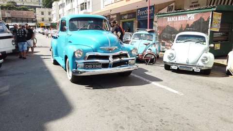 Teresopolis, RJ, Brazil - March 20th 2022 - A vintage old Chevrolet Chevy 3100 truck pickup. Light blue color, with a ladder in the side. Tyres with white stripes. Classic vintage retro suv van.