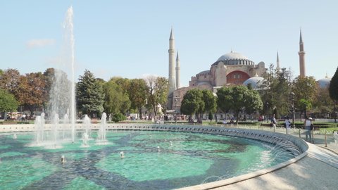 Istanbul, Turkey - September 17, 2021: View of scenic fountain at the Sultanahmet Square and the Hagia Sophia in Istanbul, Turkey. The Sultanahmet Square is a popular tourist attraction of the world.