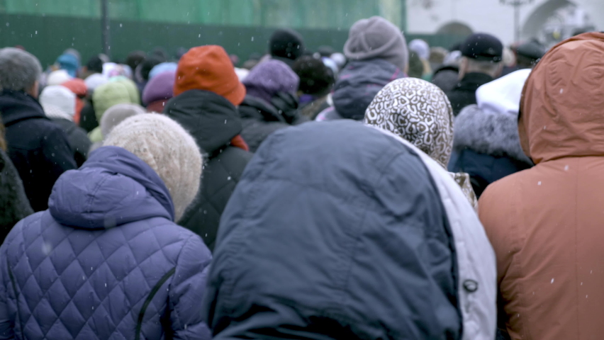 A large group of people are walking along the streets. Refugees fleeing conflict | Shutterstock HD Video #1088449985