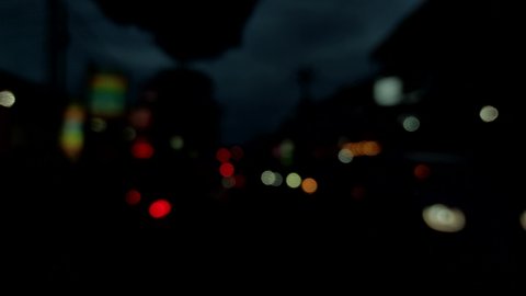 4K Bokeh of car lights, moving lights from a road of traffic at night time