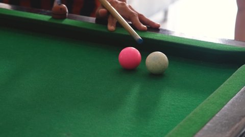 White snooker ball hitting colored balls, leisure activities at home	